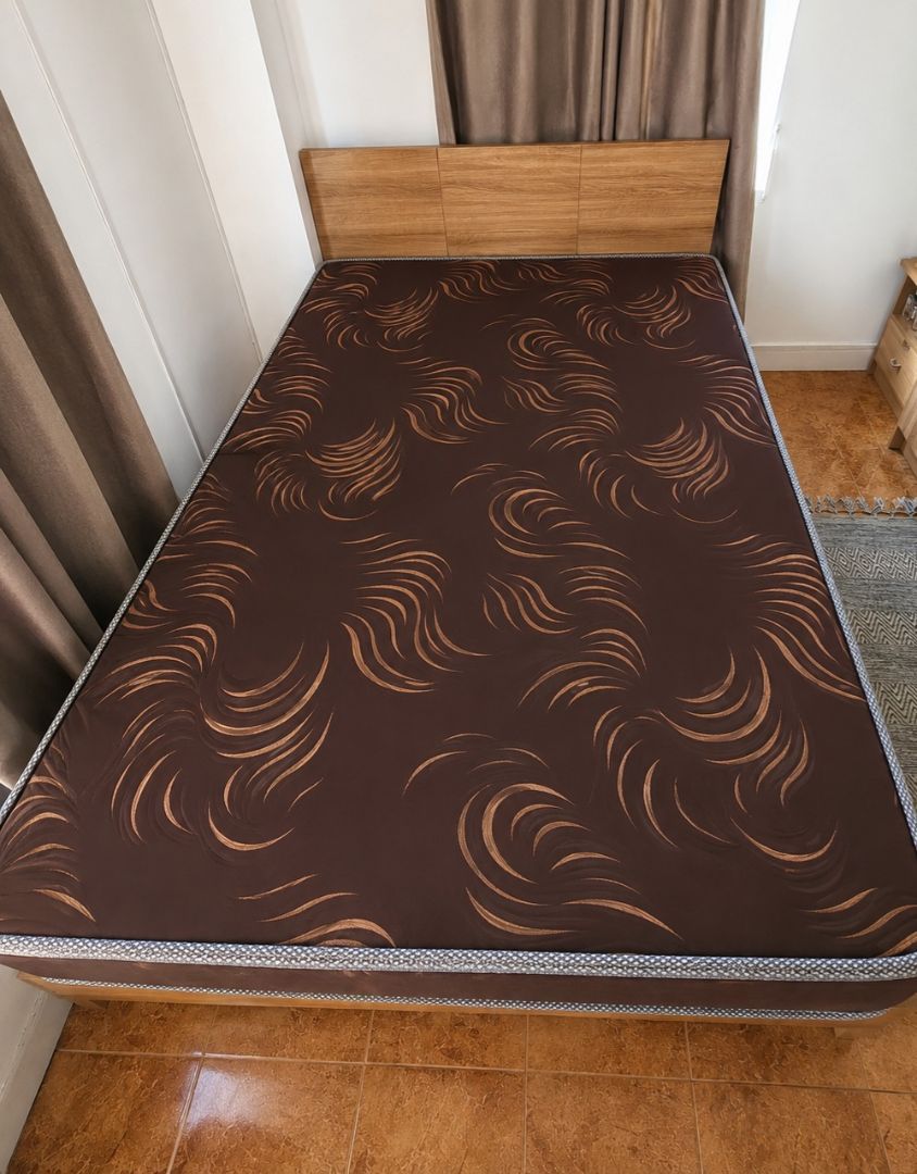 Brown Mattress with Wooden Headboard