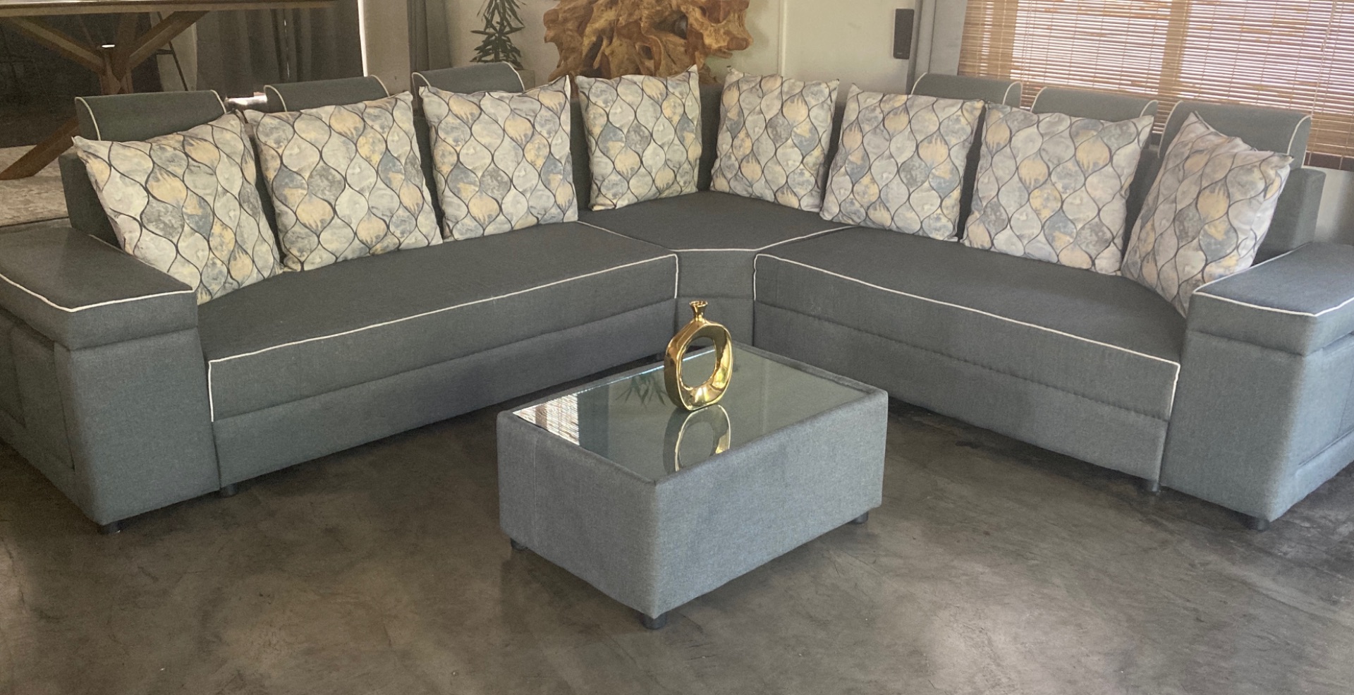 L-Shaped Grey Fabric Sofa with Patterned Cushions - Image 1 of 2